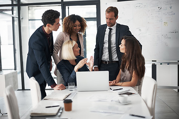 Image showing Business people, meeting and training with laptop, workshop and planning ideas in collaboration on project. Teamwork, coaching and leadership, men and women with target management in modern office.