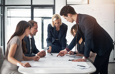 Image showing Business people, architect and blueprint in meeting, brainstorming or planning for strategy at the office. Group of contract engineers in teamwork, floor plan or documents for industrial architecture