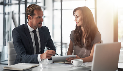 Image showing Laptop, partnership or training with a mentor and employee in the boardroom for an introduction to the business. Teamwork, coaching or collaboration with a male manager talking to a woman colleague