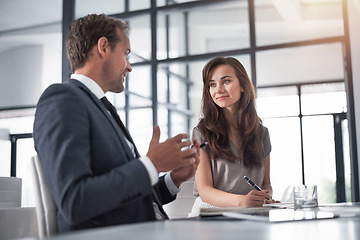 Image showing Discussion, speaking and team writing in the office while doing research, brainstorming or planning. Partnership, meeting and professional designers working on a creative project in the workplace.