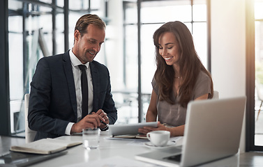 Image showing Laptop, collaboration or coaching with a mentor and employee in the boardroom for an introduction to the business. Teamwork, training or partnership with a male manager talking to a woman colleague