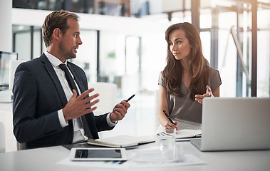 Image showing Laptop, collaboration or training with a mentor and employee in the boardroom for an introduction to the business. Teamwork, coaching or partnership with a male manager talking to a woman colleague