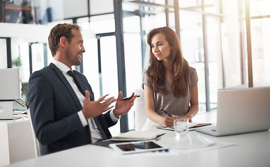 Image showing Laptop, collaboration or education with a mentor and employee in the boardroom for an introduction to the business. Teamwork, coaching or partnership with a male manager training a woman colleague