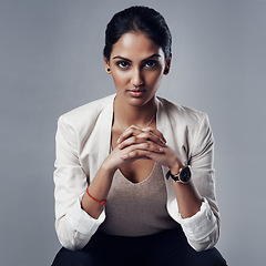 Image showing Confident, portrait of a businesswoman and against a studio background for success. Elegance or assertive, empowerment or proud and female person pose for positive mindset against a backdrop
