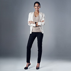 Image showing Happy, arms crossed and portrait of business woman in studio for professional, natural or confidence. Smile, corporate and career with female employee on grey background for manager and pride