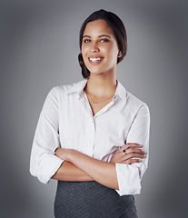 Image showing Pride, arms crossed and portrait of business woman in studio for professional, natural or confidence. Happy, corporate and career with face of female employee on grey background for manager and smile