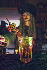 Image showing Bartender serving cocktail for Halloween