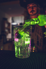 Image showing Bartender creates amazing Halloween themed drinks