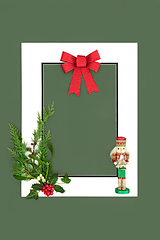 Image showing Christmas Background Frame with Nutcracker Flora and Red Bow