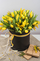 Image showing Bright spring bouquet of tulips and mimosa flowers