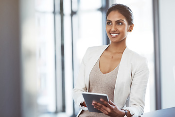 Image showing Tablet, accountant and thinking woman in office for business, research app and internet email online. Smile, digital technology and corporate Indian auditor with idea, planning or vision for company.