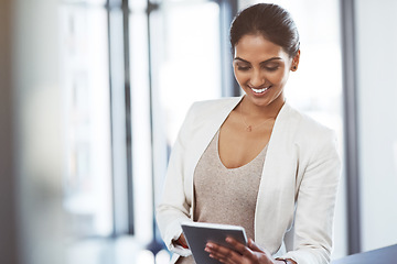 Image showing Tablet, accountant and happy woman in office for business, research or online browsing. Smile, digital technology and corporate Indian auditor reading email, internet app or website info in company.