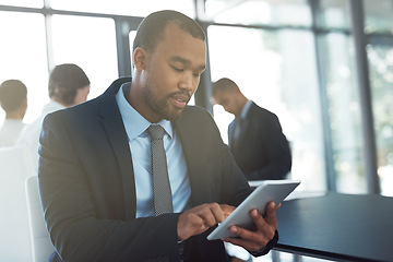 Image showing Tablet, accountant and black man in office for business, research or online browsing. Serious, digital technology and corporate African auditor reading email, internet app or website info in company.