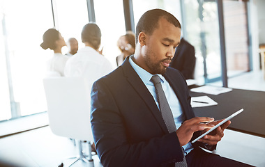 Image showing Tablet, lawyer and black man in office for business, research or online browsing. Serious, digital technology and corporate African attorney, person or professional reading email, internet app or web