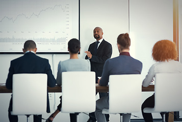 Image showing Presentation, colleagues in a business meeting and planning in a boardroom of their workplace. Data review or statistics, collaboration or teamwork and people in a workshop for strategy or analytics