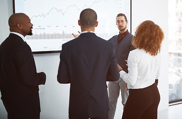 Image showing Business, group and man with a presentation, corporate training and financial review with teamwork. Finance, staff or presenter with a chart, graphs or feedback for a budget, collaboration and growth