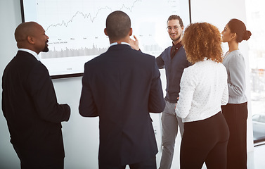 Image showing Business people, staff or man with presentation, graphs for profit growth or discussion for planning. Presenter, group or team with financial charts, investment or conversation for feedback or review