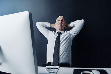 Image showing Elderly business man, pride and relax in office for satisfaction, achievement and smile at finance company. Mature ceo, relief or rest at desk with hands behind head, happy or thinking in workplace