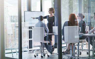 Image showing Woman pointing, teaching or business people in presentation for sales report or data analysis. Education, leadership or manager planning strategy on screen monitor in mentorship training or meeting