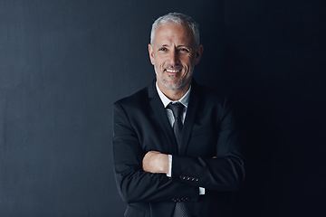 Image showing Arms crossed, smile and face of business man in studio for professional, corporate or manager. Boss, pride and confidence with senior male ceo on black background for executive and mockup space