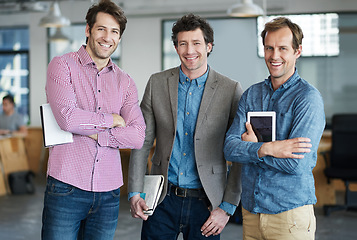 Image showing Confident team, portrait or business developers in meeting for brainstorming together in office with smile. Proud people, tablet or happy programmers with technology, notes or notebook in workplace