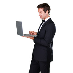 Image showing Male waiter, typing and laptop with service and suit in white background is working at restaurant. Butler, bowtie and technology with man in hospitality with tuxedo, luxury and menu in studio.