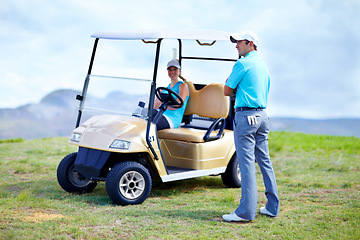 Image showing Golf cart, couple or golfers on field for fitness, workout or exercise with teamwork on green course. Woman driver, man golfing or athletes training in game exercising or driving together in vehicle
