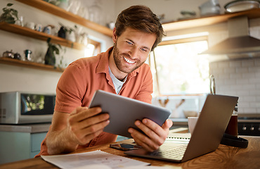Image showing Technology, happy man with tablet and laptop for remote work in kitchen of his home with a lens flare. Social networking or connectivity, online communication and male person smile for email