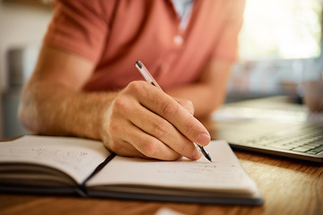 Image showing Man, hands and writing on book with pen for notes, schedule planning or strategy on table at home. Closeup hand of male person with notebook for ideas, reminder or information in research or studying