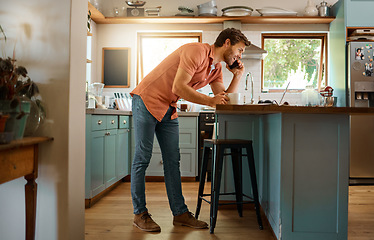 Image showing Phone call, laptop and planning with man in kitchen for remote work, communication and networking. Contact, technology and internet with person at home for freelancer, social media and connection