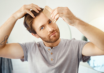 Image showing Bathroom portrait, brush and man with hair maintenance, texture grooming or morning self care. Salon, wellness and person with comb for healthy hairstyle growth, styling treatment or home hygiene