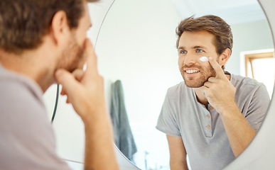 Image showing Bathroom, mirror reflection or man with cream, lotion or moisturizer for acne treatment, skin hydration or beauty routine. Face cosmetics, cosmetology or home person with morning ointment application