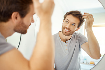 Image showing Bathroom, mirror reflection and happy man with hair care routine for maintenance, beauty process or hygiene cleaning treatment. Smile, morning and home person style locks for clean shampoo hairstyle