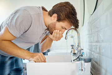 Image showing Man in bathroom, mouth wash and water with morning routine, health and wellness in home. Dental care, cleaning teeth and face with male grooming for fresh breath, hygiene and getting ready in house.