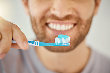 Image showing Brushing teeth, toothbrush and closeup with man in bathroom for self care, oral hygiene and dental. Cleaning, smile and health with male person at home for beauty, wellness and morning routine