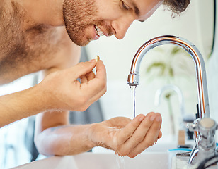 Image showing Bathroom, tap water and man with pills, tablet or morning supplements for healthcare, wellness or medication. Liquid drink, sink and home person eating vitamin for health balance, energy or nutrition