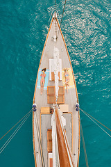 Image showing Travel, ocean and aerial of women on boat on water for cruise, luxury sailing and transport for holiday. Relax, summer and female people on yacht for tropical journey, sunbathing and vacation trip