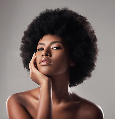 Image showing Black woman, portrait and face, natural beauty and afro hair with dermatology and glow on studio background. African female model, cosmetic care and healthy skin, facial and shine with skincare