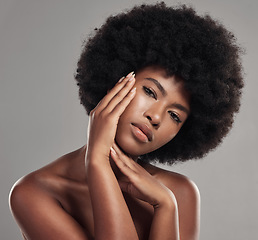 Image showing Black woman, portrait and hands touching face, natural beauty and afro hair with glow on studio background. African female model, cosmetic care and healthy skin, facial and shine with skincare