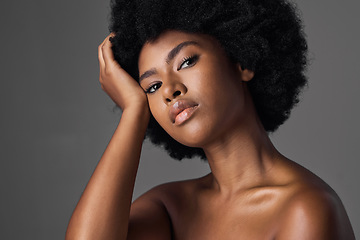 Image showing African woman, beauty and studio portrait with afro, skincare and cosmetics by grey background. Girl, model and healthy with natural glow on skin with makeup, clean aesthetic and wellness for face