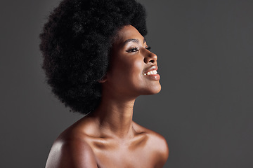 Image showing Hair, smile and profile of black woman with afro hairstyle, beauty and skincare on grey background. Haircare, cosmetics and beautiful face of happy African model with skin glow and shine in studio.
