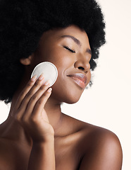 Image showing Black woman, beauty and eyes closed with skincare, cotton pad and natural cosmetics on white background. Clean makeup from face, wellness and skin, African female model with glow and dermatology