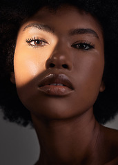 Image showing Shadow, portrait and black woman with beauty light, natural facial makeup and aesthetic skincare shine. Creative studio lighting, cosmetology and African person face with self care on grey background