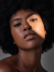 Image showing Dark portrait light, makeup or black woman with beauty foundation, natural facial cosmetics and spa skincare shine. Studio lighting, face shadow or African person with glowing skin on grey background