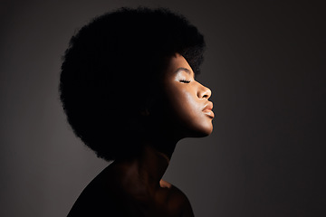 Image showing Face shadow, light and black woman with skincare, natural beauty glow and peace after cosmetics treatment. Aesthetic makeup profile, afro and African studio person with self care on grey background