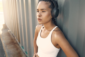 Image showing Fitness break, breathe or woman running in city listening to music, podcast or radio playlist in sports exercise. Wellness, headphones or tired girl athlete resting after training or workout outdoors