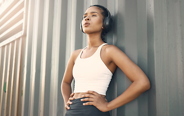 Image showing Fitness break, breathe or girl runner in city listening to music, podcast or radio playlist in sports exercise. Wellness, headphones or tired woman athlete resting after training or workout outdoors