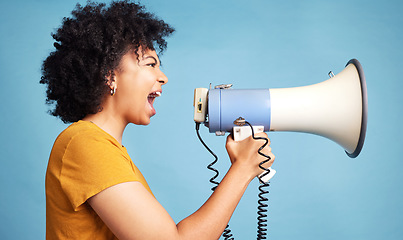 Image showing Megaphone, voice and young woman for human rights, racism and equality, freedom of speech, strong opinion or fight, African person protest, call to action or change and justice on a blue background