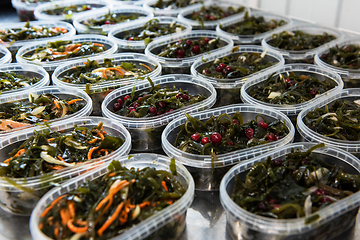 Image showing Different fish and chuka wakame laminaria seaweed salad