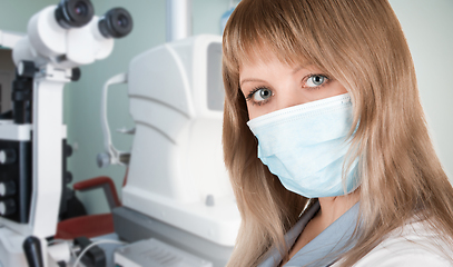 Image showing Female ophthalmologist in protective mask